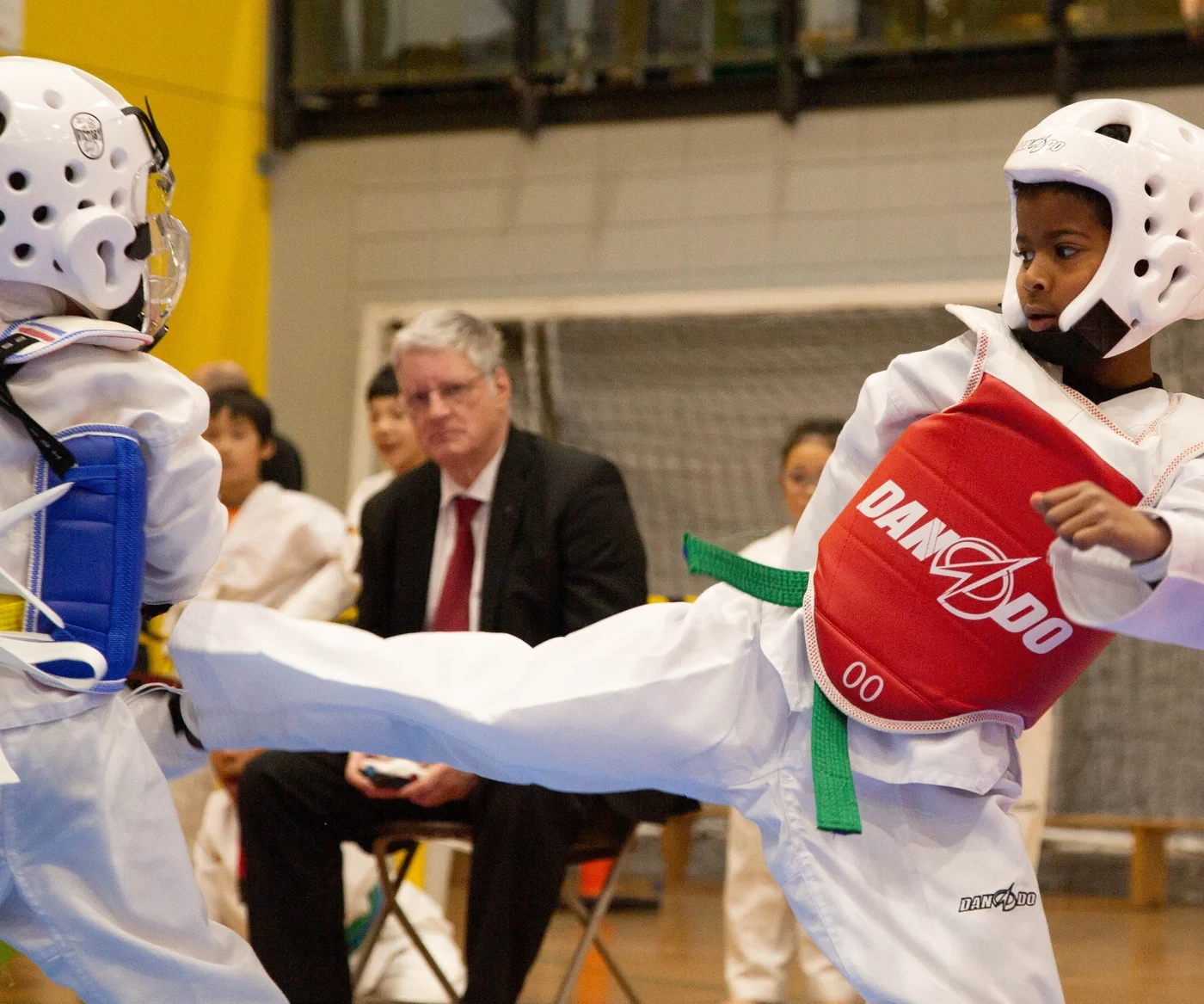 M.T.L Taekwondo athletes sparring at a tournament