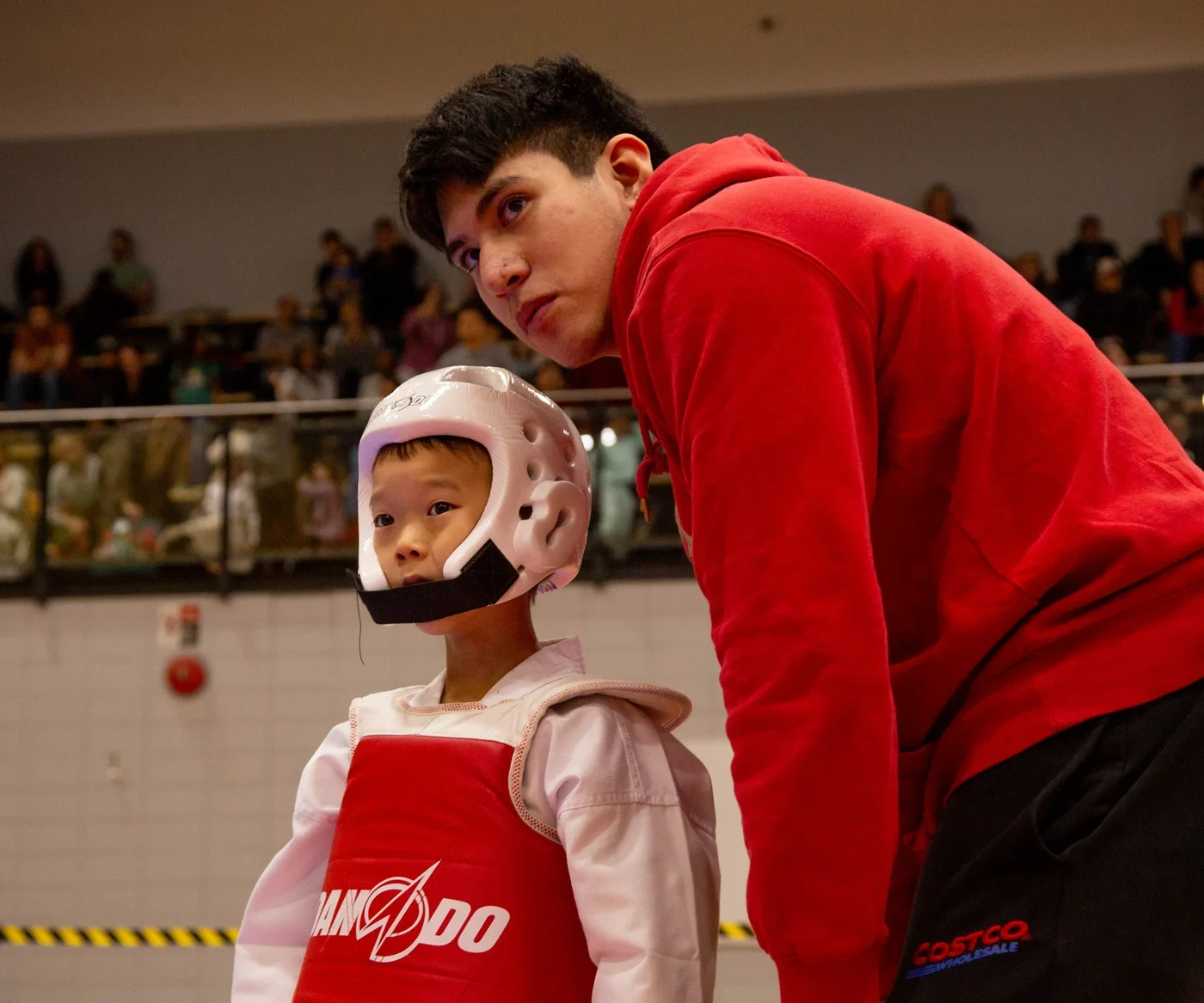 M.T.L Taekwondo coach and competitor at a tournament